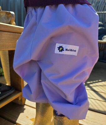 Child wearing children's overpants in lilac