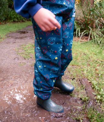 Child wearing space overpants