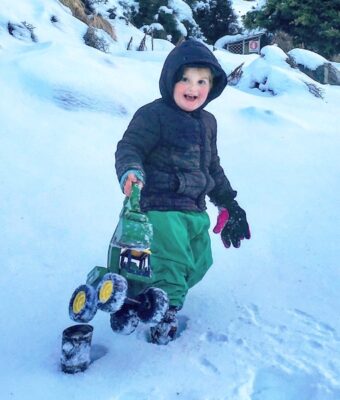 Boy Playing in Snow wearing Green NZ-Made Childrens Waterproof Fleece Lined Pants