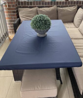 Mud Mates, NZ-made, navy, elasticated Fitted Tablecloth protecting an outdoor dining table