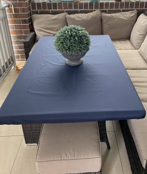 Mud Mates, NZ-made, navy, elasticated Fitted Tablecloth protecting an outdoor dining table