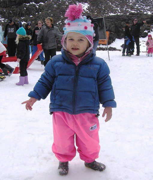 Young girl in snow wearing Mud Mates NZ-made pink Fleece Lined Pants