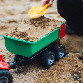 Sandpit play using construction toys