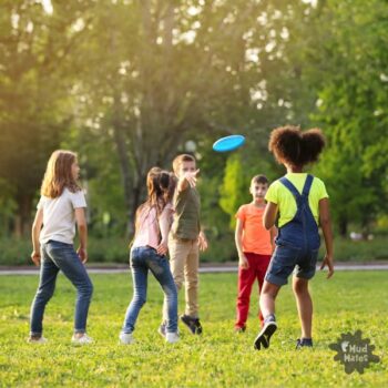 Kids playing frisbee golf - a fun outdoor picnic game