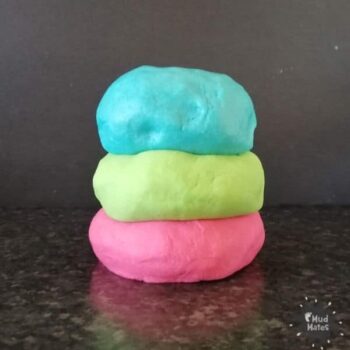 Pile of coloured playdough for creative playdough ideas
