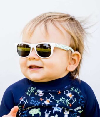 Baby boy wearing Beachcomber Confetti Green kids sunglasses