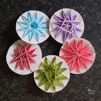 5 woven Matariki stars in blue, purple, pink, green and red