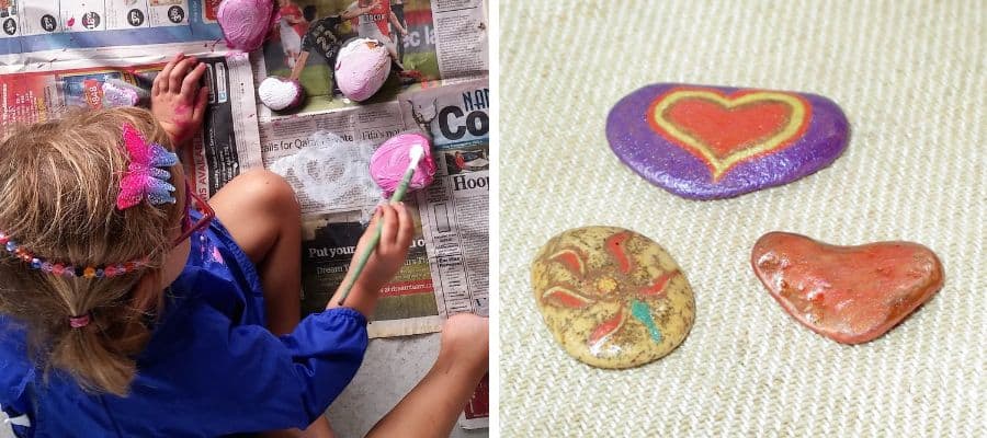 Young child painting rocks to make paperweights and painted stone paper weights - Father's Day Crafts idea for preschoolers