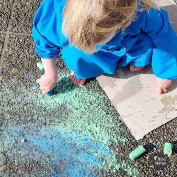 Puddle Art for kids: child drawing in a puddle with coloured chalk