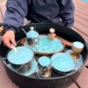 Child playing with Mud Mates fizzing aqua NZ-made Magic Potions
