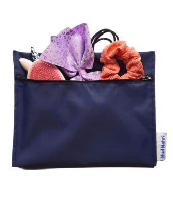 NZ-Made Waterproof Mini Zippered Wet Bag in navy being used for hair brush and hair accessories