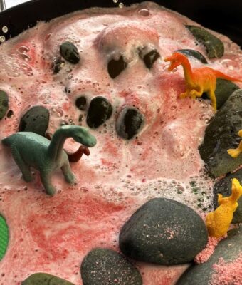 Foaming Magic Potions - Ruby Red foaming during play with dinosaurs
