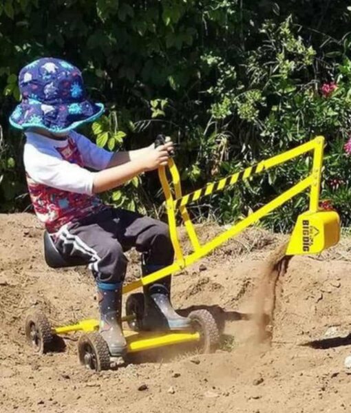Young child playing on a toy digger in sandpit wearing sharks and octopus design reversible sun hat. Shop UPF 50+ reversible kids sun hats