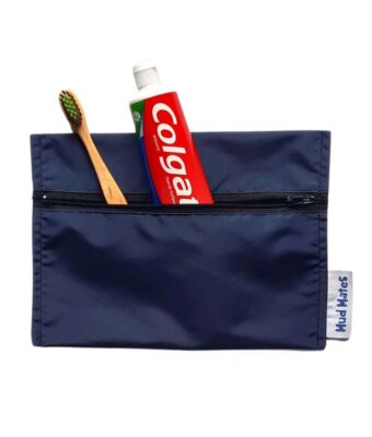 NZ-Made Waterproof Mini Zippered Wet Bag in navy being used to store a toothbrush and toothpaste