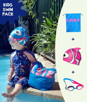 Save Money with a Kids Swim Pack: Toddler girl sitting by swimming pool with her personalised NZ-made swim bag, kids goggles and swim cap