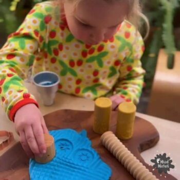 Young girl playing with playdough