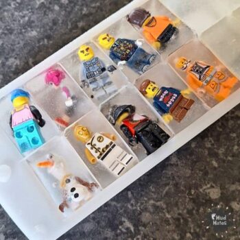 LEGO mini-figures frozen in an ice cube tray, ready for LEGO Ice Rescue: a Fun Science & Sensory Play for Kids
