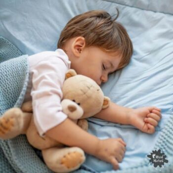 Toddler sleeping peacefully after managing toddler sleep regression