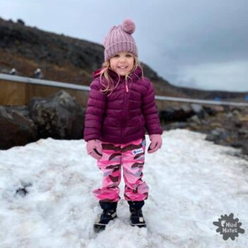 Young girl dressed for winter/the snow, wearing layered waterproof clothing - a great example of how to dress kids for winter.