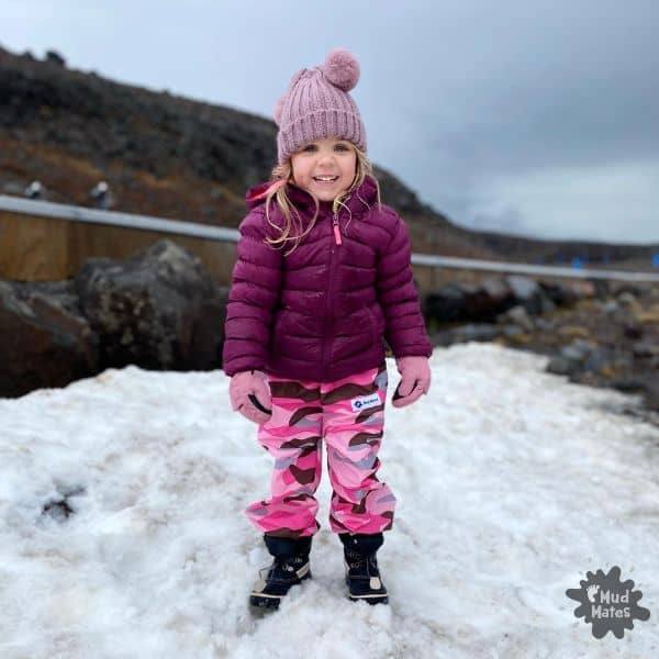 Young girl dressed for winter/the snow, wearing layered waterproof clothing - a great example of how to dress kids for winter.