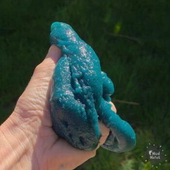 Taste-safe slime being squeezed in a hand, made from just two ingredients.