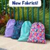 Four personalised swim bags in lilac, space, spearmint and floral fabrics by the pool